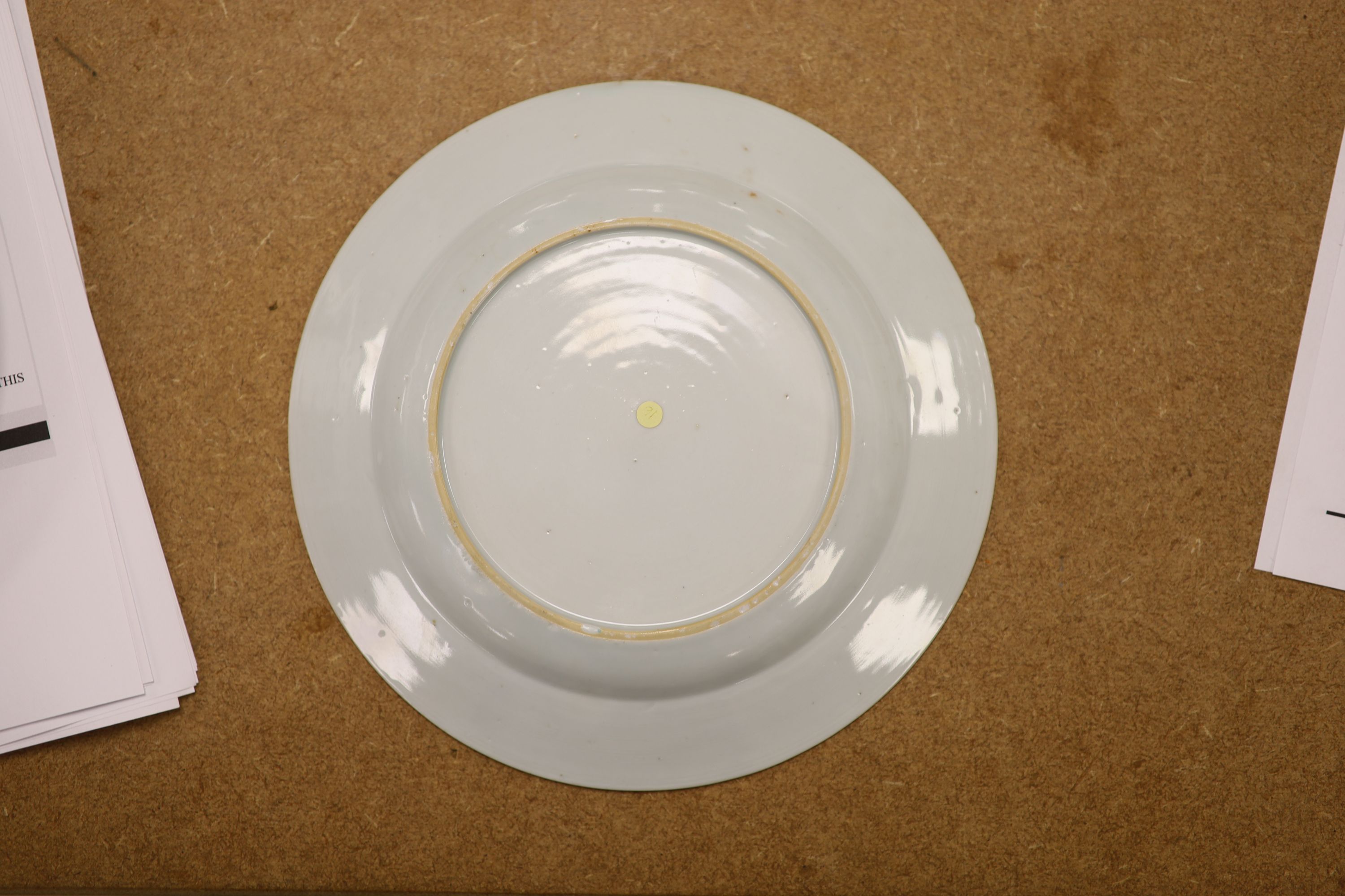 A pair of 18th century Chinese famille rose plates and another similar, largest diameter 22.5cm (damage)